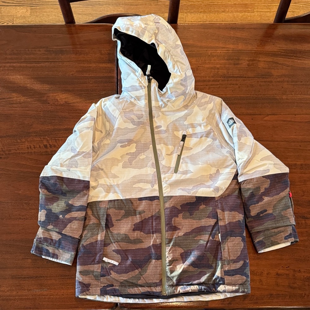 686 Kids Ski Puffer Jacket - White and Brown with green accents.